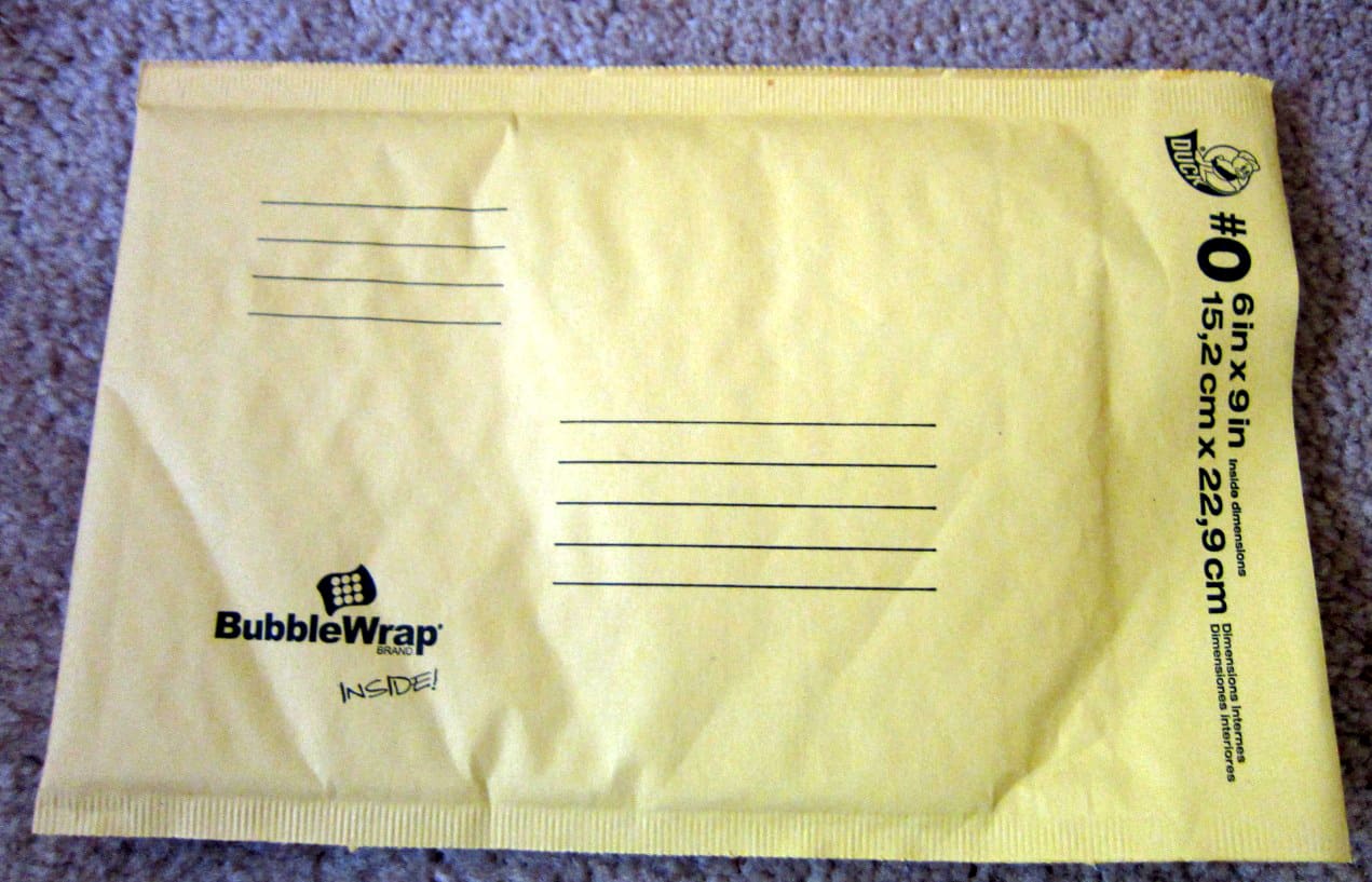 A flat paper padded mailing envelope with printed address lines